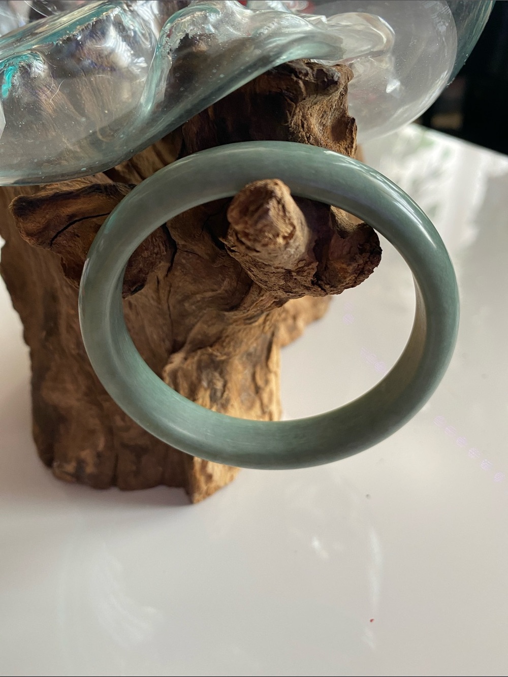 Green one of a kind jade bangle. Comes with a crystal ring.